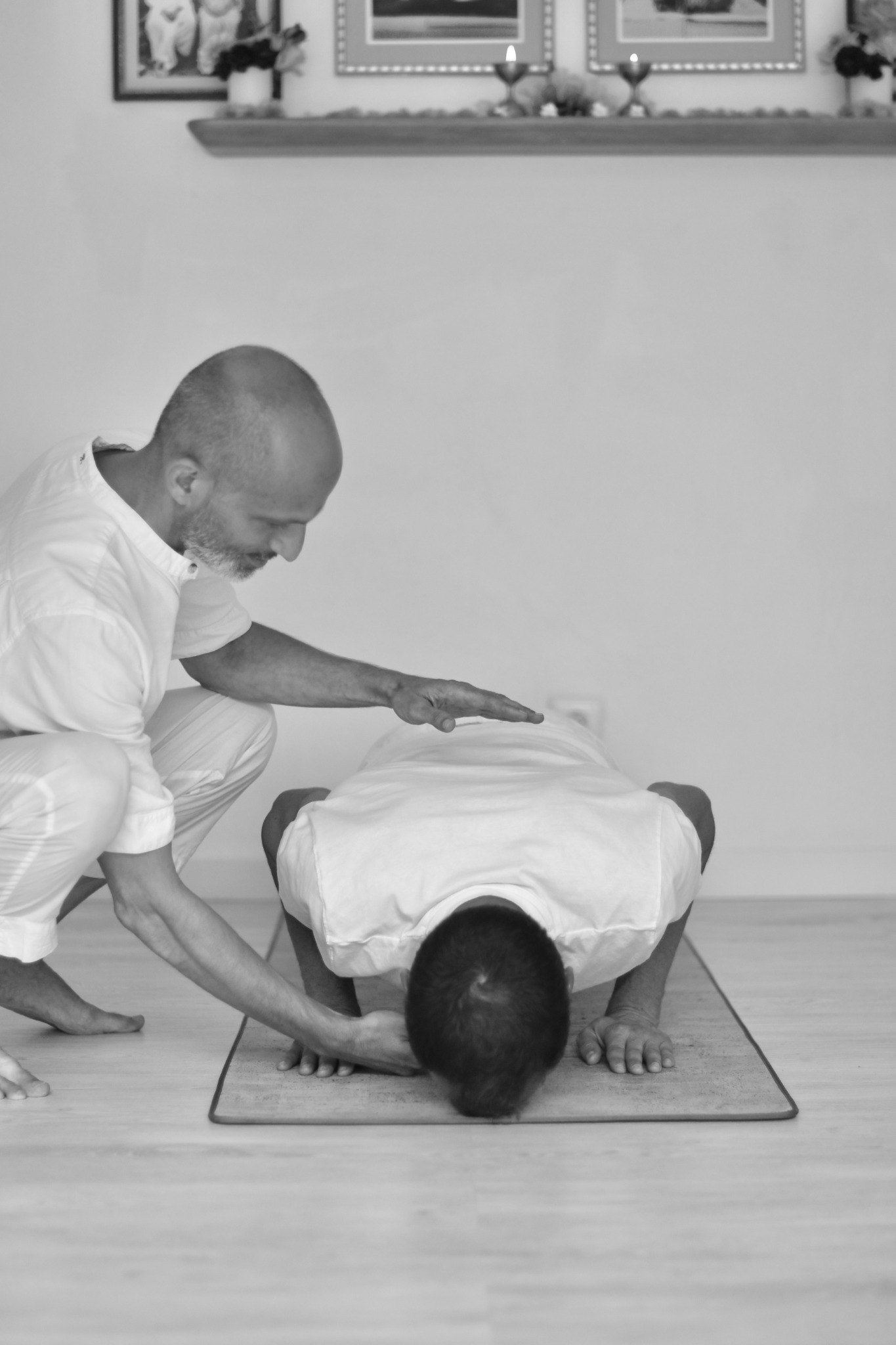Lior guiding a student through asana